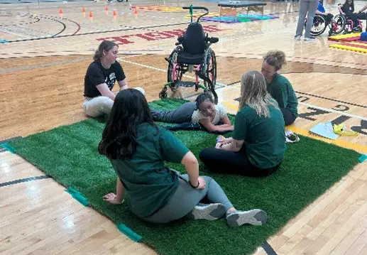 Children learning wheelchair skills