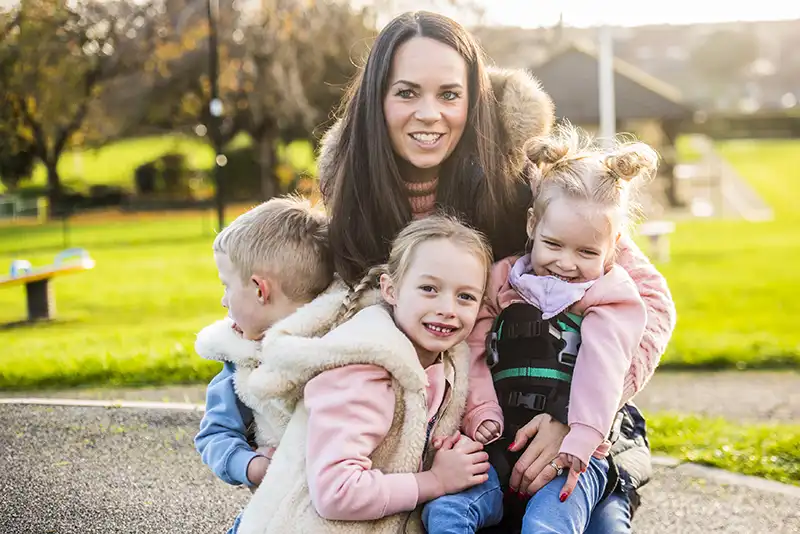 A girl with her family in a park