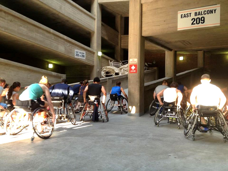 Megan's team pushing up and down the football stadium ramps