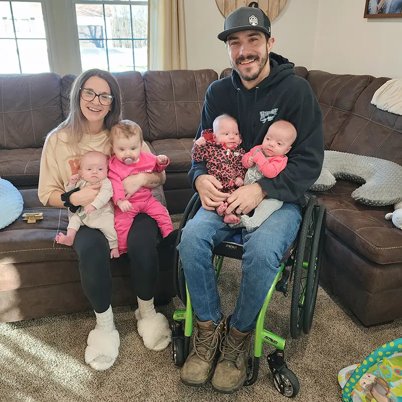 Zac with his wife and children