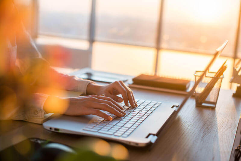 A woman working on her computer