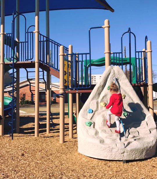 Jamey's daughter playing in a playground