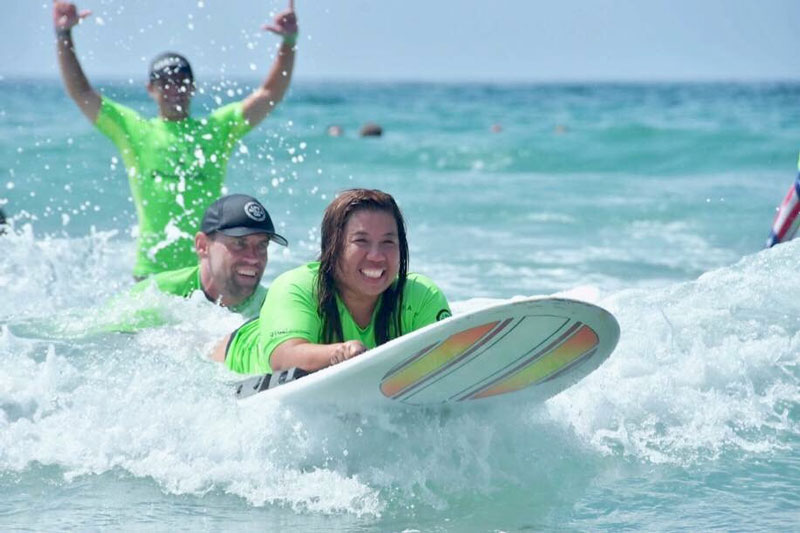 Channing surfing in the ocean