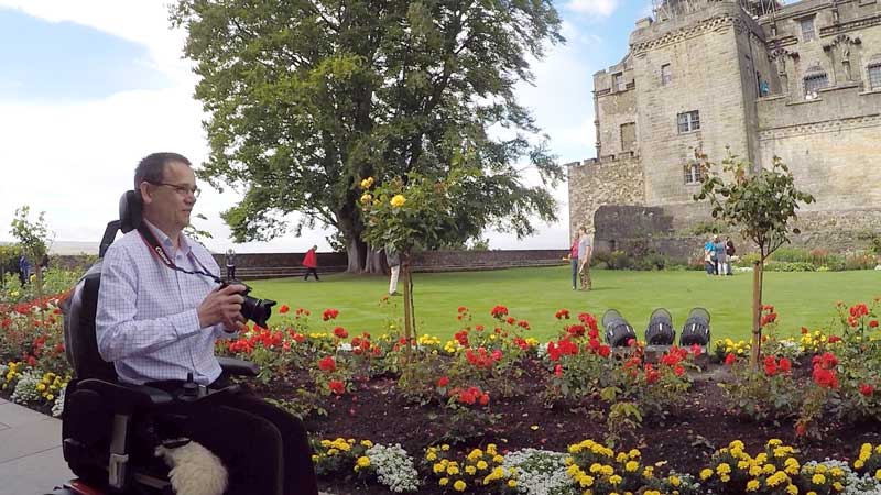 Paul taking photos of flowers