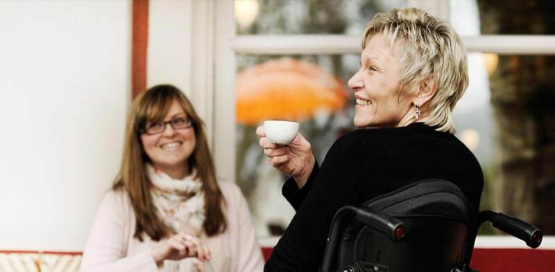 A woman having coffee with her friend