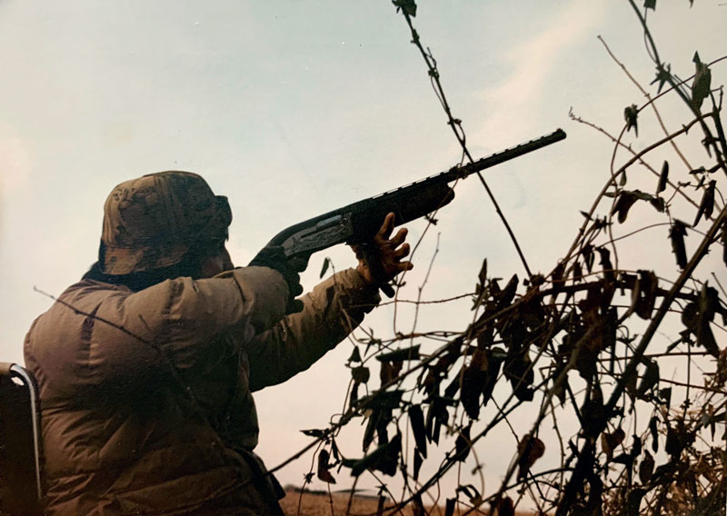 Norm firing his modified shotgun