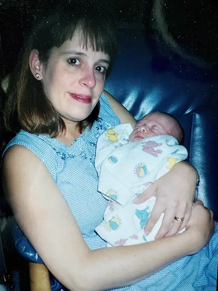 Rachel holding her newborn son