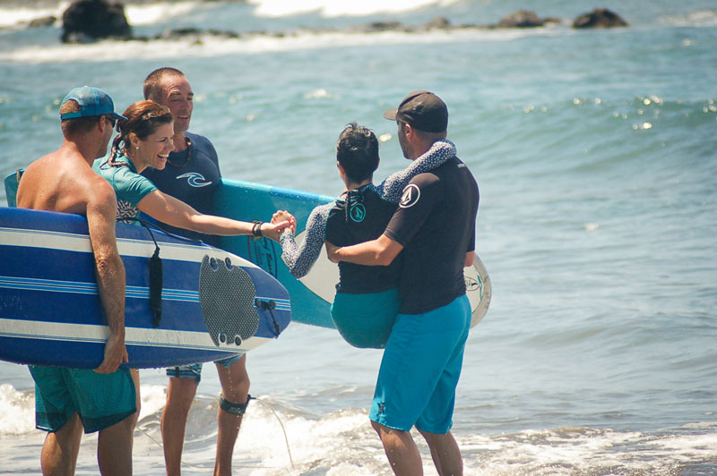 Genevieve being carried into the water